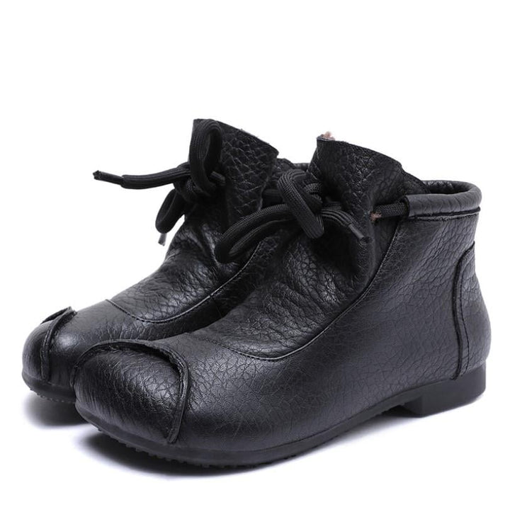 Close-up side view of Lena comfort boots highlighting the smooth silhouette and supportive sole