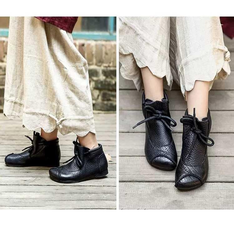 Pair of Lena comfort boots in coffee placed side by side on a light surface