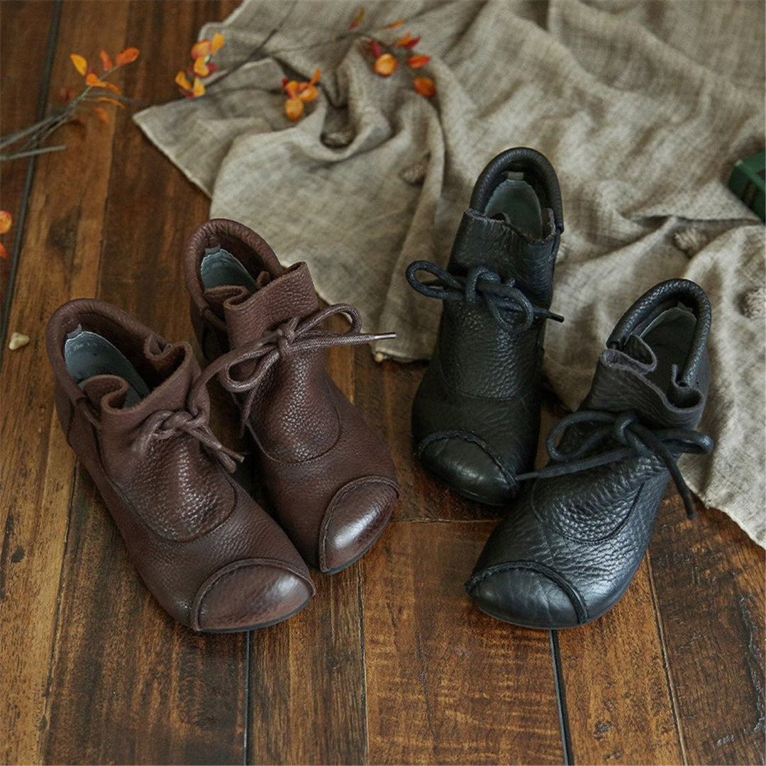 Lena comfort boots in black shown from a three-quarter angle to highlight the leg-lengthening silhouette
