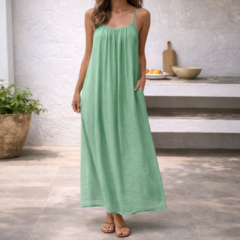 Side view of the Lena spaghetti strap maxi dress in mint highlighting the relaxed flowing silhouette