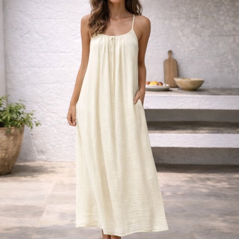 Full-length view of the Lena linen maxi dress in cream showing the floor-length hem