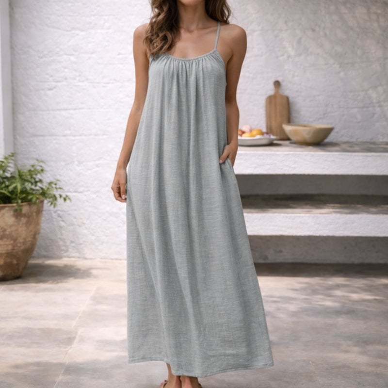 Close-up of the side pocket detail on the Lena linen sundress in light gray