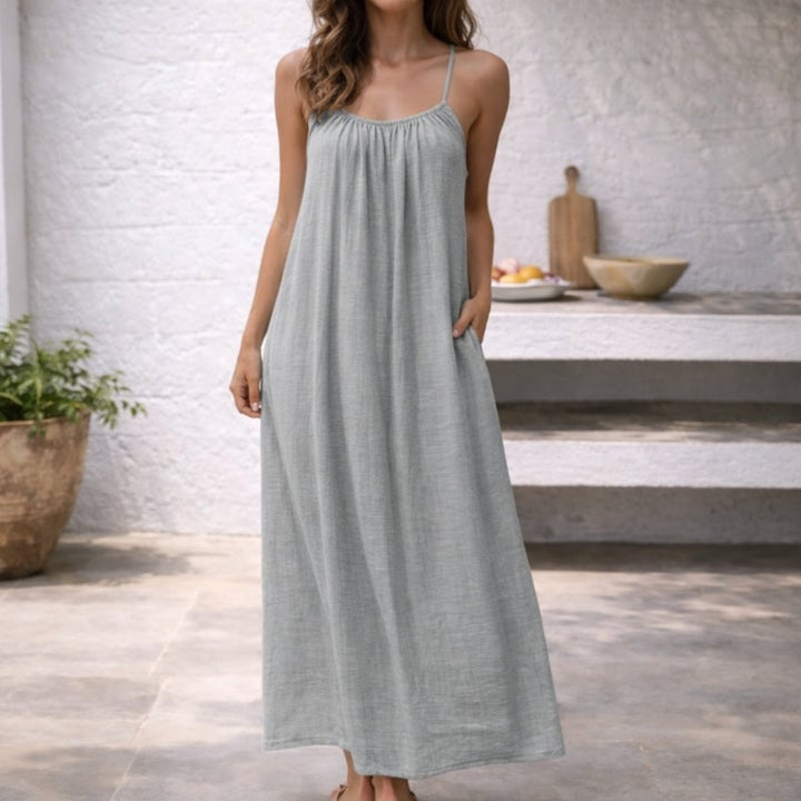 Close-up of the side pocket detail on the Lena linen sundress in light gray