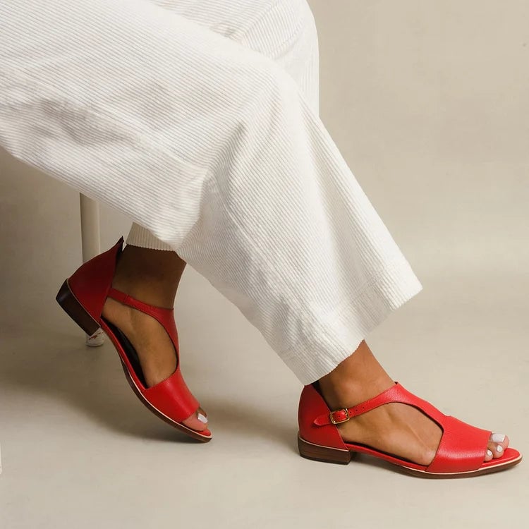 Women's Lennox flat sandals in red with open-low silhouette and slip-on design, shown from a front three-quarter angle