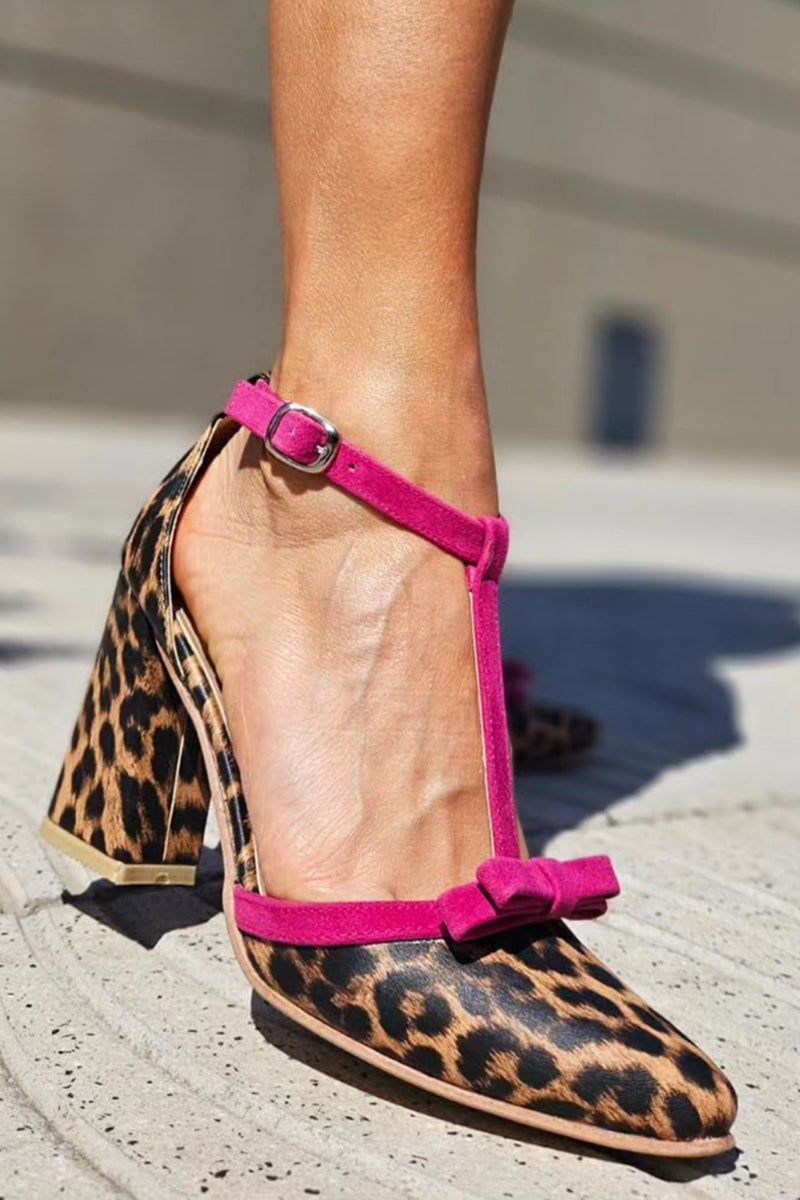 Green leopard print stiletto sandal with colorful accent straps, side view on white background