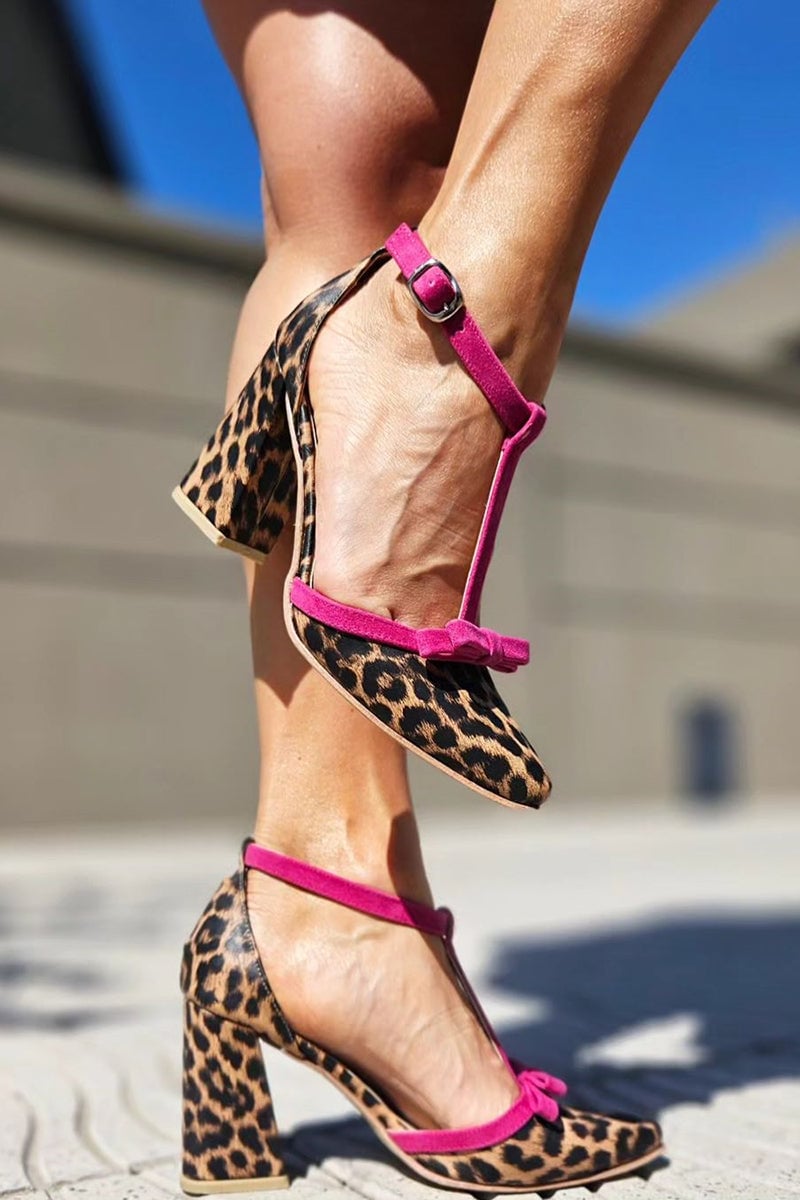 Close-up of green leopard print stiletto sandal showing ankle strap and heel detail