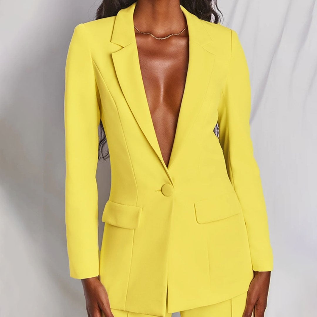 Close-up of the tailored blazer and matching trousers set in a chic, polished style from Florimay