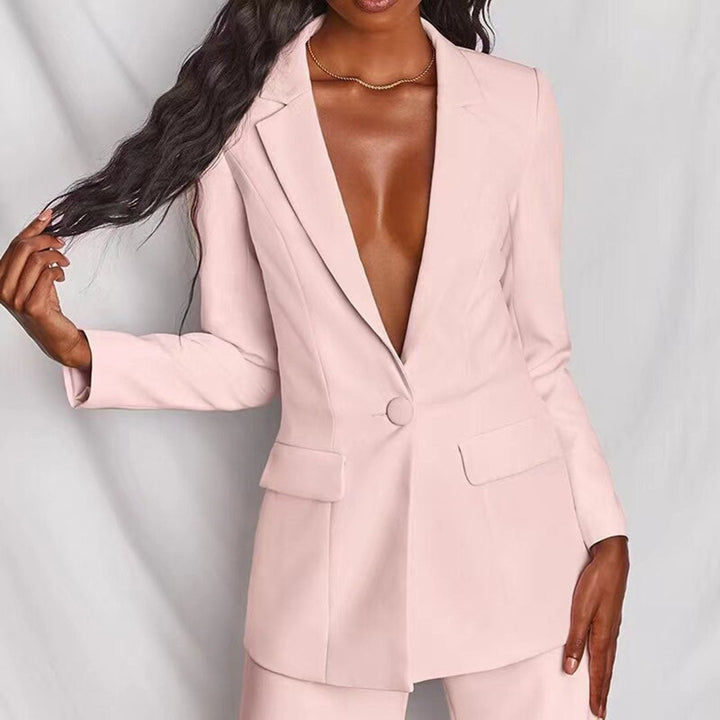 White two-piece blazer and trousers set styled elegantly on a model from Florimay