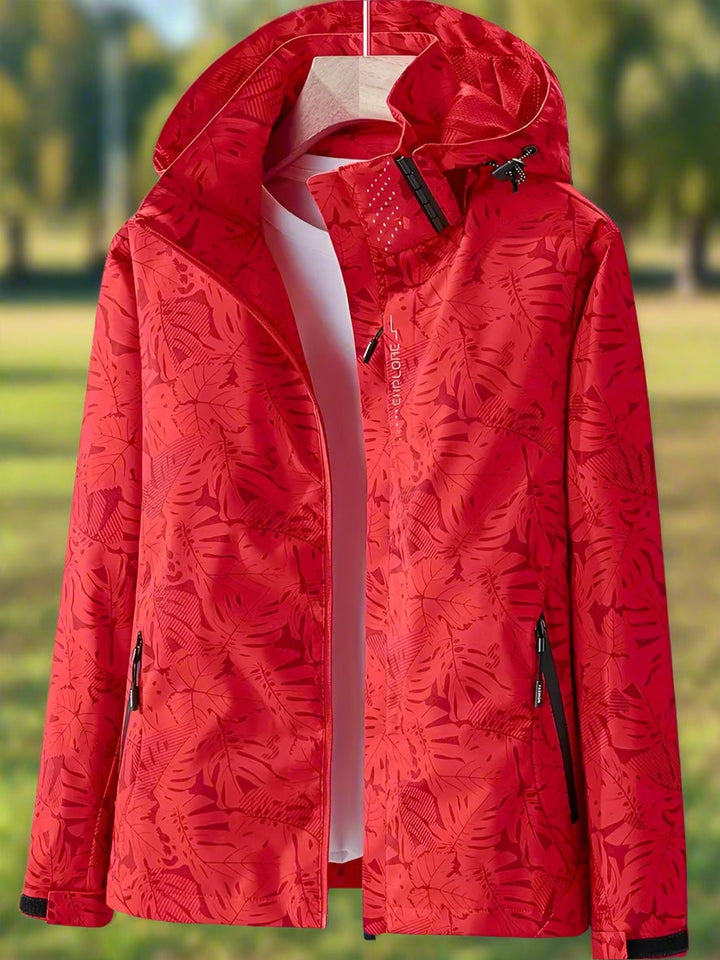 Close-up of the nature-inspired leaf pattern on a lightweight waterproof women's jacket in green