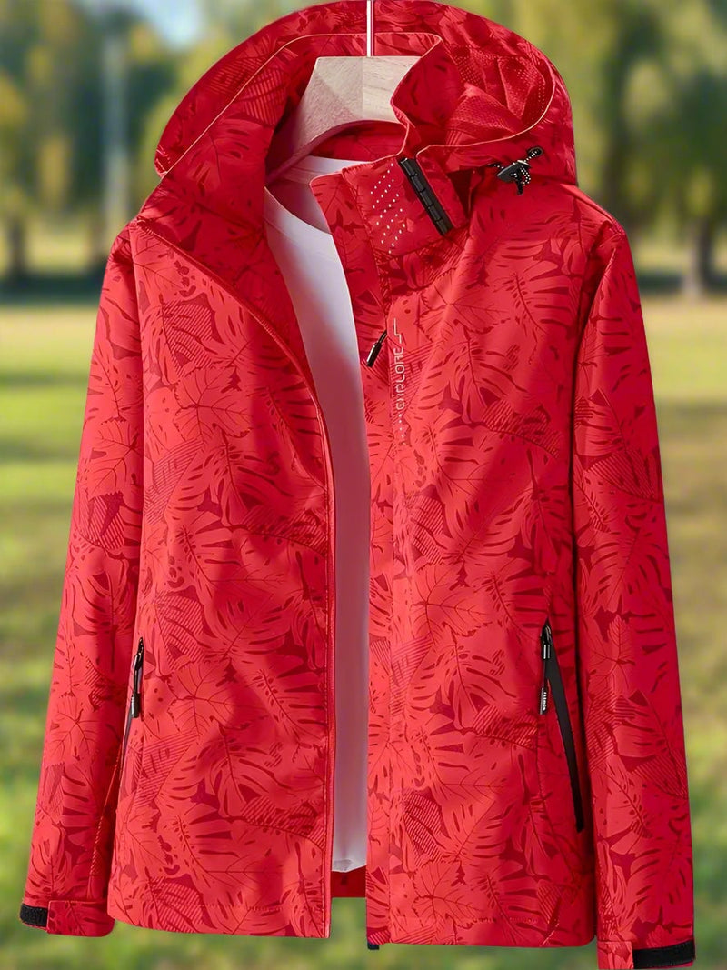 Close-up of the nature-inspired leaf pattern on a lightweight waterproof women's jacket in green