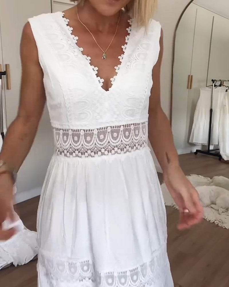 Side view of a woman in a white boho draped wrap dress showing soft fabric movement