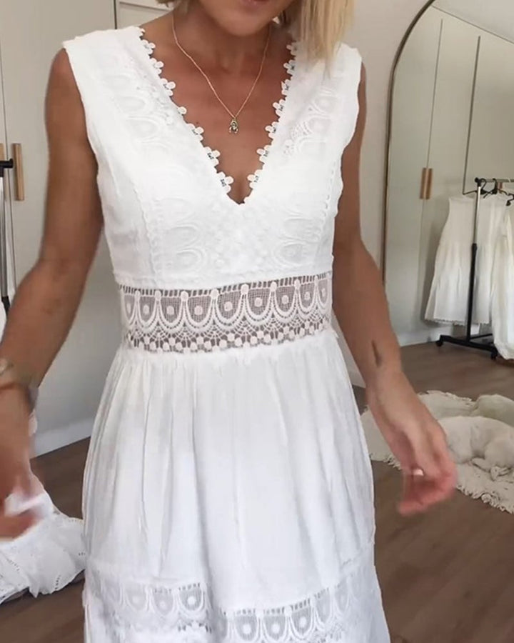 Side view of a woman in a white boho draped wrap dress showing soft fabric movement