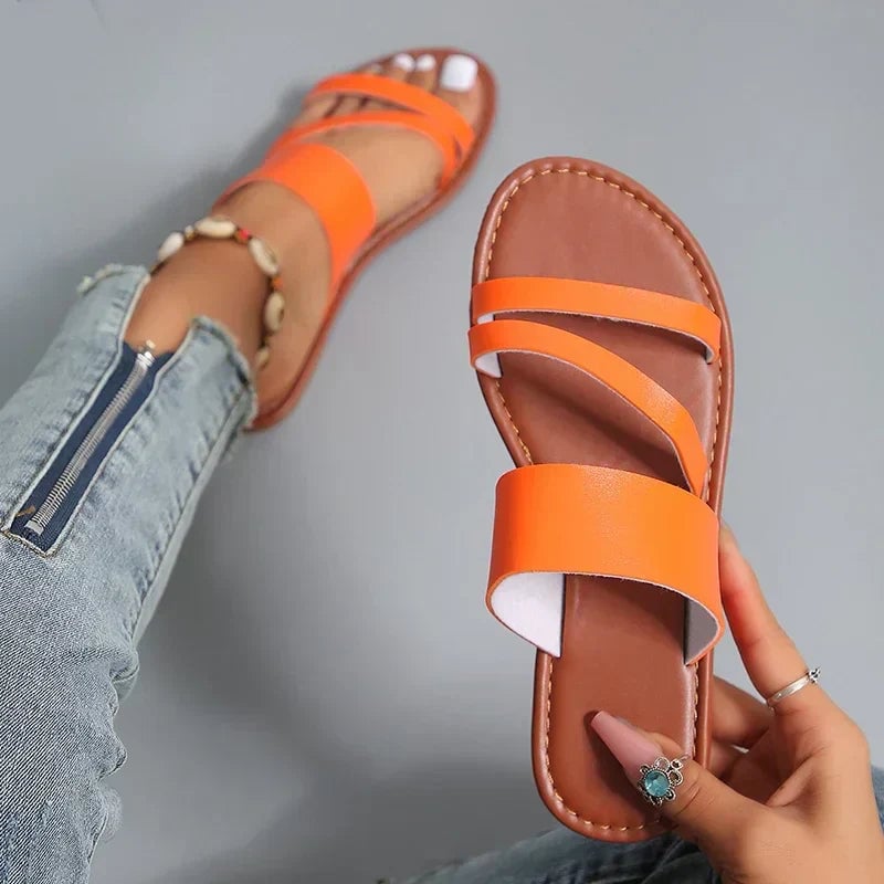 Lilac flat sandals in brown, back view showing heel strap and flexible sole