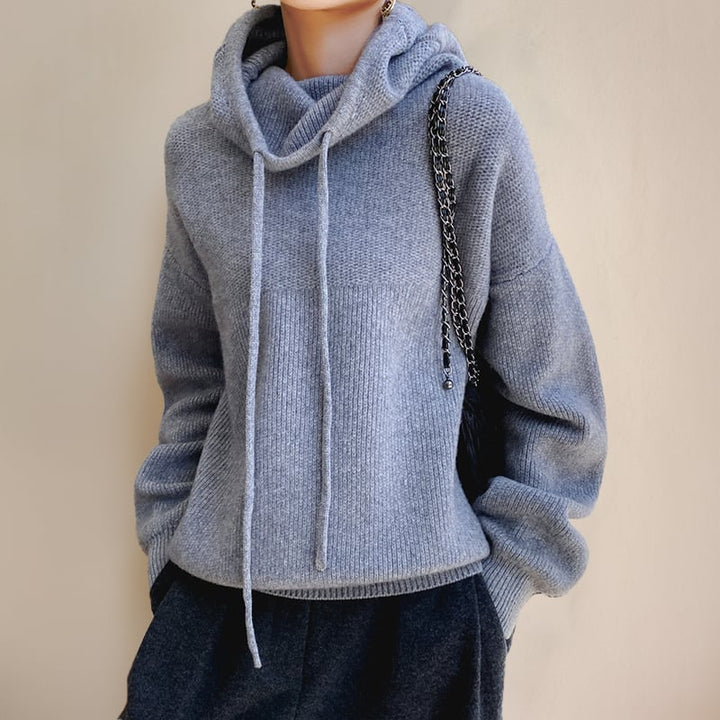 Luna hoodie sweater in dark blue styled for casual cold-weather layering