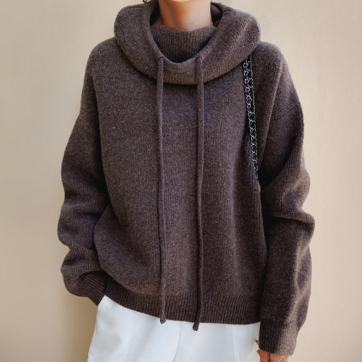 Side profile of the Luna cozy hoodie sweater showing flattering silhouette