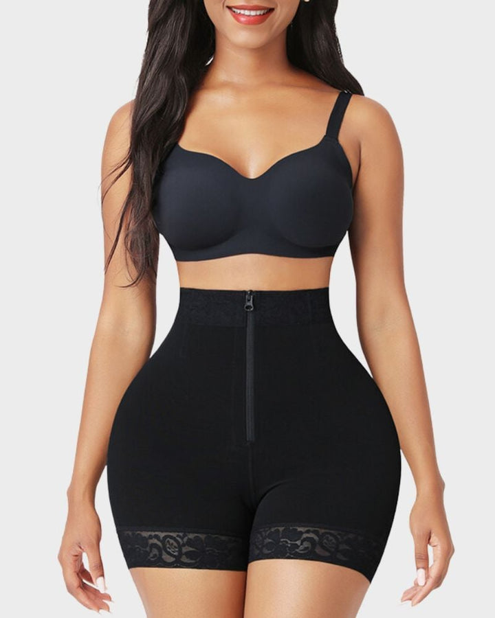 Model wearing black shapewear shorts showing defined waistline and smooth tummy panel