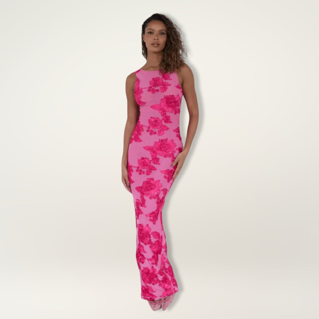 Front view of a soft pink floral maxi dress showing the feminine silhouette and lightweight fabric