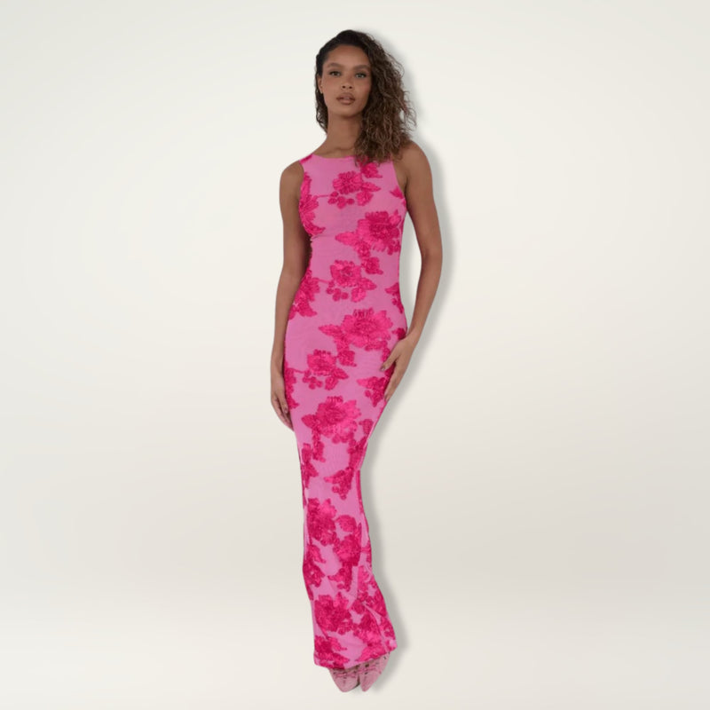 Front view of a soft pink floral maxi dress showing the feminine silhouette and lightweight fabric