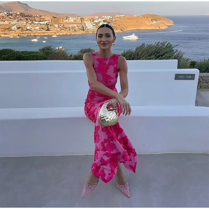 Full-length view of a pink floral maxi dress on a woman, perfect for summer occasions and evening events