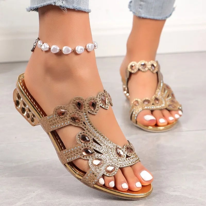 Close-up of Linda sandal embellishment detail in gold highlighting intricate design