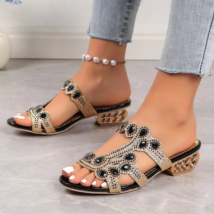 Top-down view of Linda embellished sandals in gold showing adjustable strap hardware