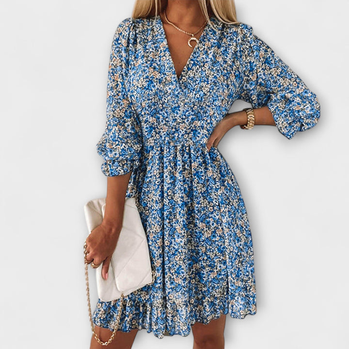 Close-up of floral print and puff sleeve detail on a lightweight summer dress