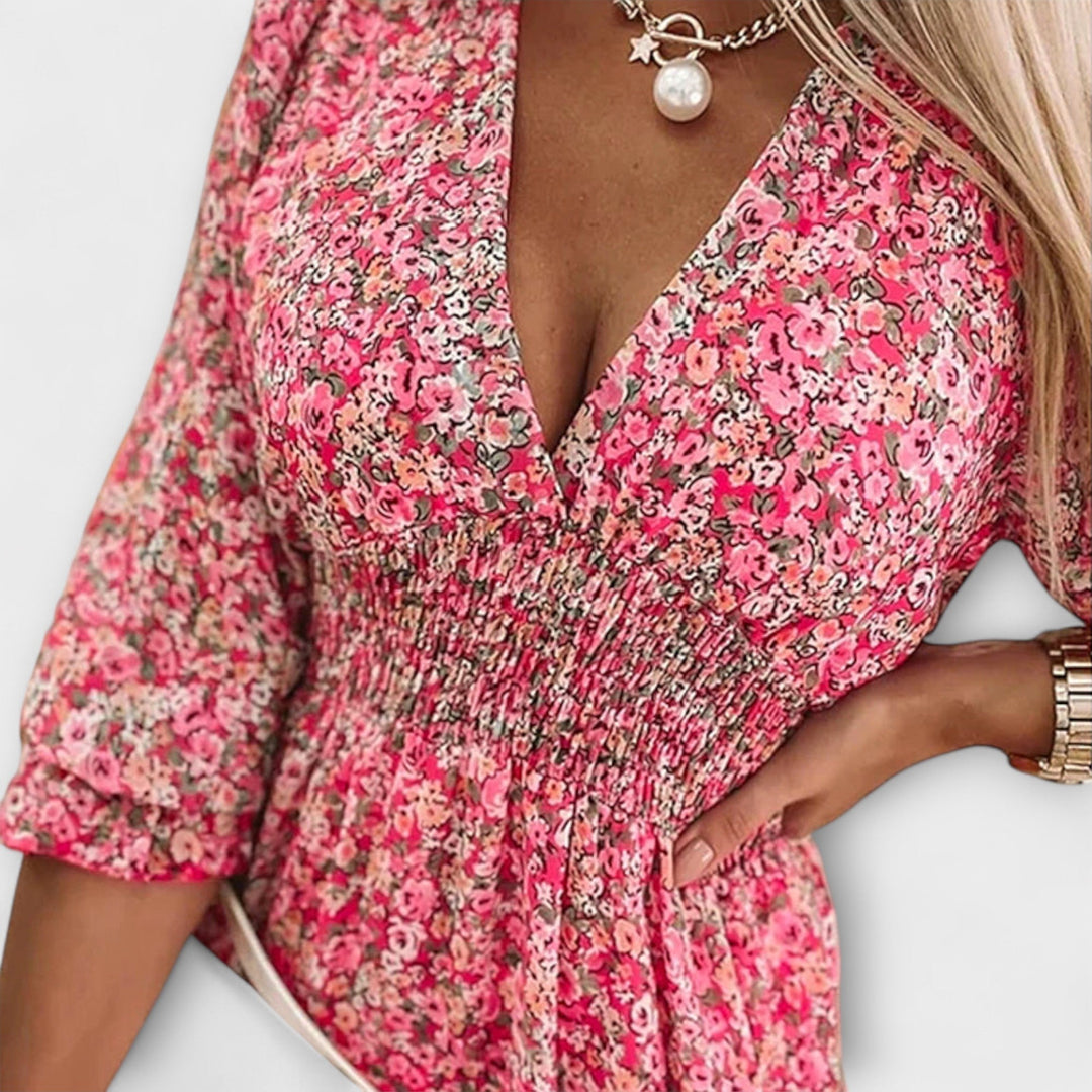 Side view of a floral puff sleeve dress showing the silhouette and hem length