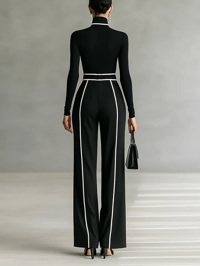 Close-up of contrast white trim detail on gray high-neck top from coordinated two-piece set