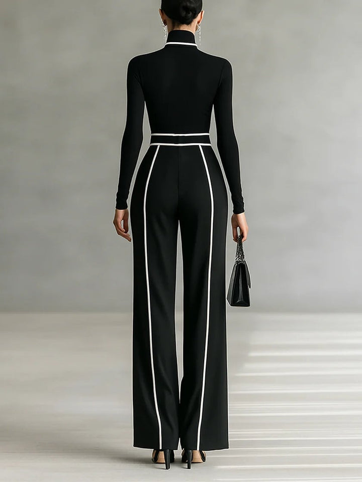 Close-up of contrast white trim detail on gray high-neck top from coordinated two-piece set