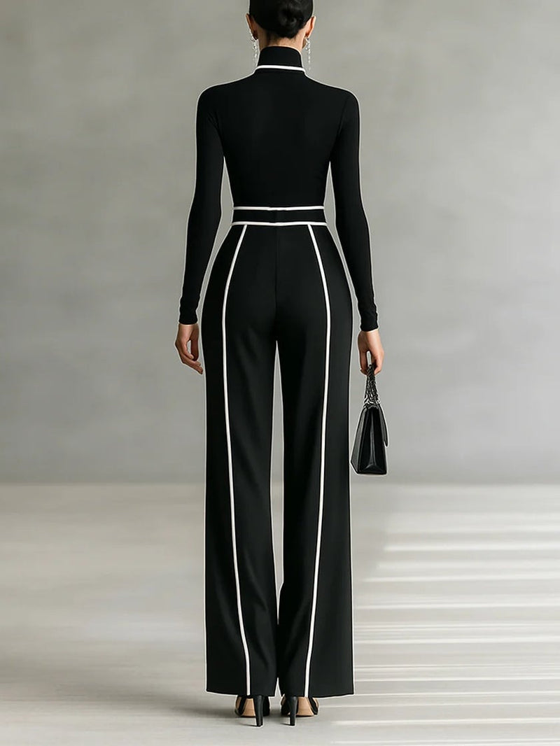 Close-up of contrast white trim detail on gray high-neck top from coordinated two-piece set