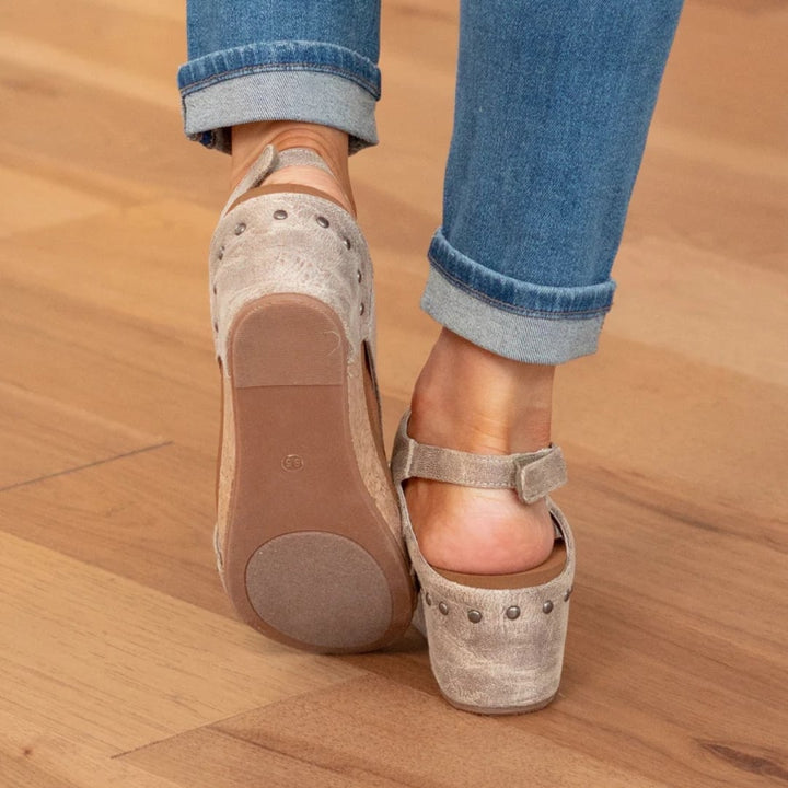 Close-up of elastic strap detail on Linda suede wedge sandals in brown