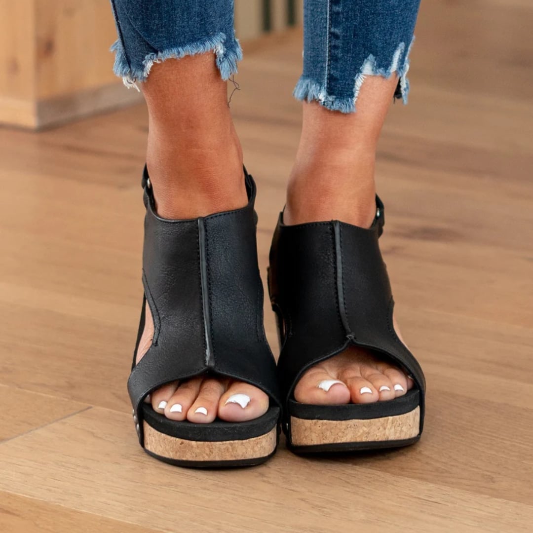 Front view of Linda closed-toe wedge sandals in black suede