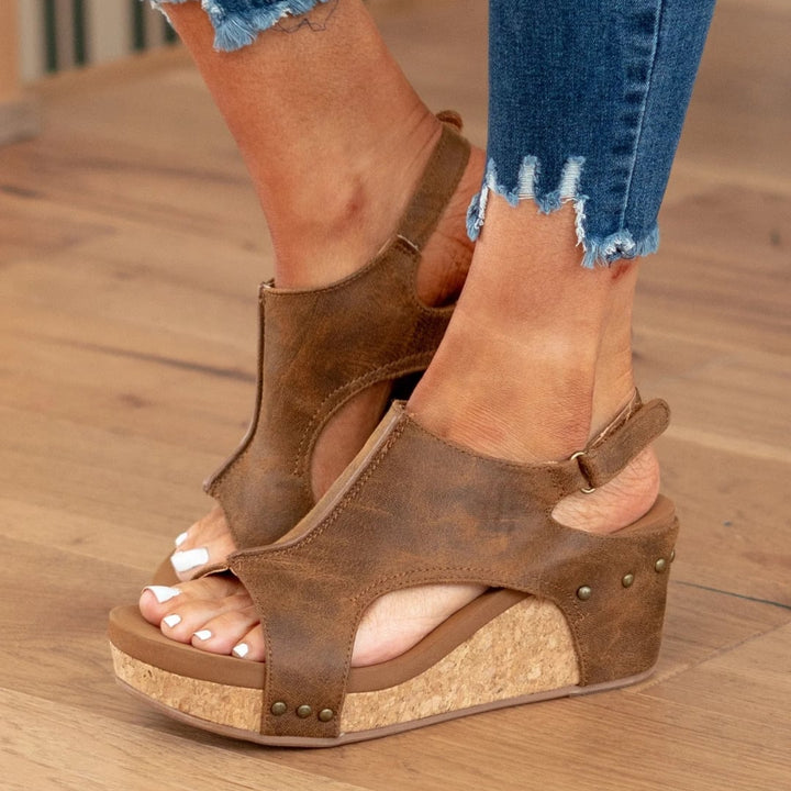 Linda beige wedge sandals worn with cropped linen pants, lifestyle shot
