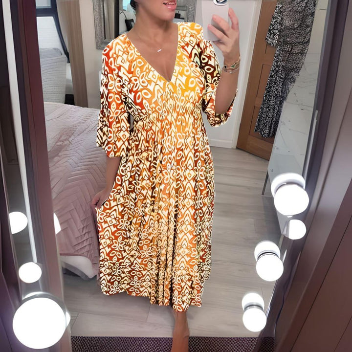 Woman styling the Linden boho printed dress with sandals for a casual warm-weather look