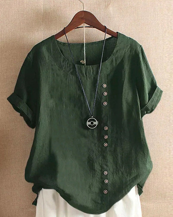 Women's linen short sleeve top in brown with relaxed silhouette, front view on model