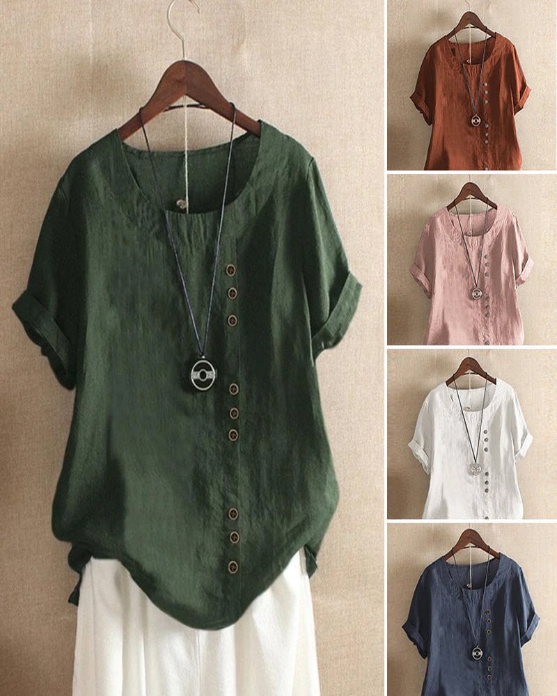 Women's linen casual top in green showing cuffed sleeves and curved hem, three-quarter view