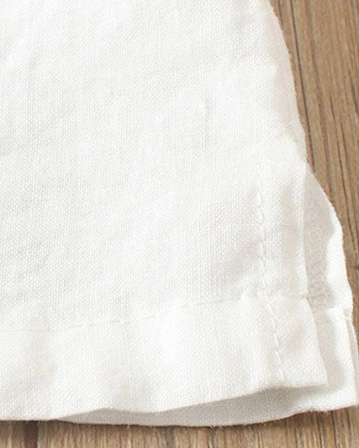 Flat lay of women's linen button-front top showing all five color options: pink, white, brown, blue, and green