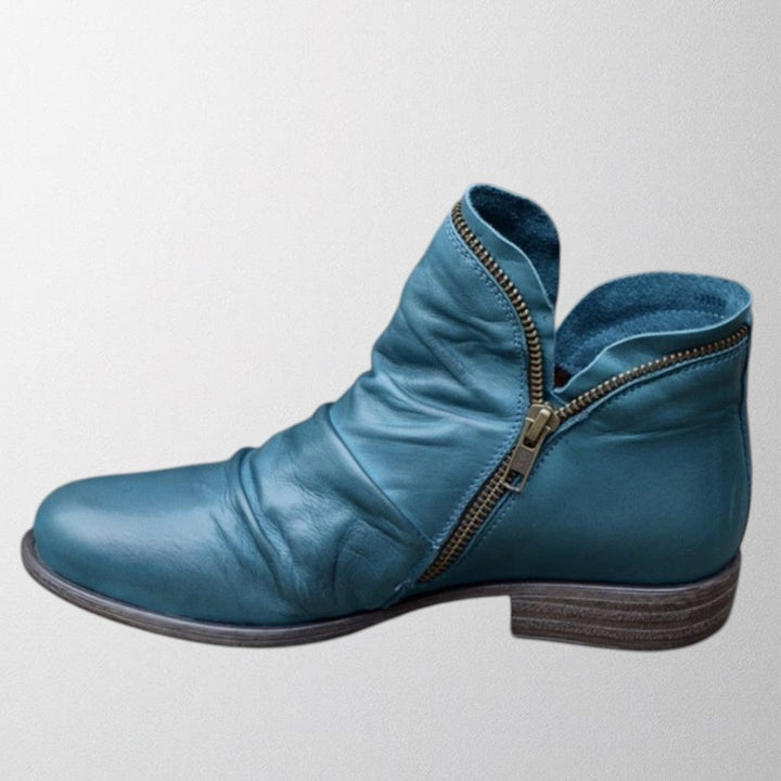 Lisa orthopedic boots in blue displayed on a clean white background showing full boot structure