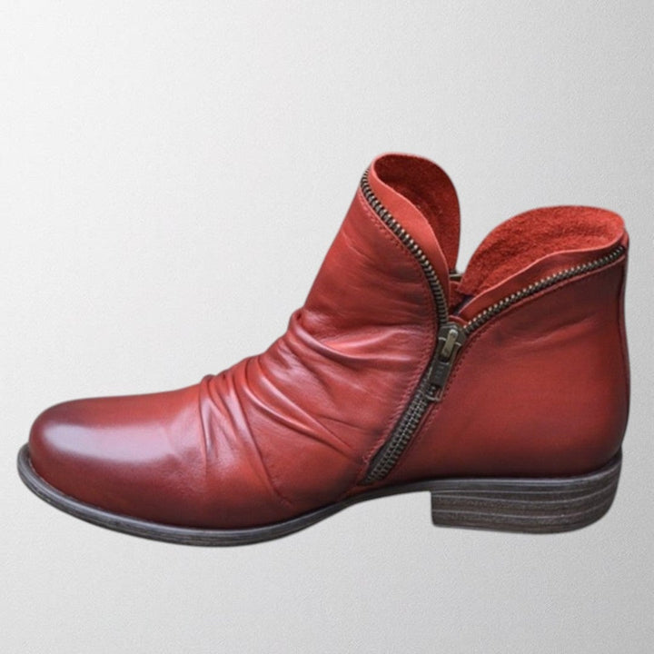 Close-up of Lisa orthopedic boot sole in red demonstrating shock-absorbing outsole construction