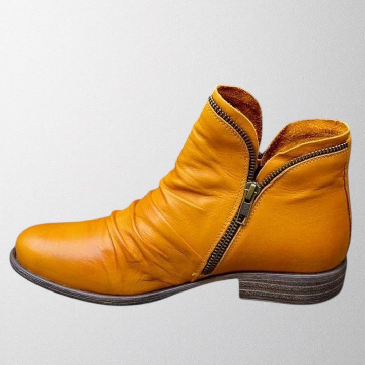 Lisa orthopedic boots in yellow shown at a three-quarter angle to highlight leg-lengthening silhouette