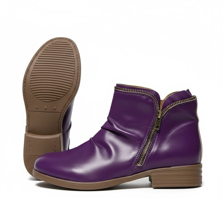 Overhead flat-lay of Lisa orthopedic boots in blue on a neutral background