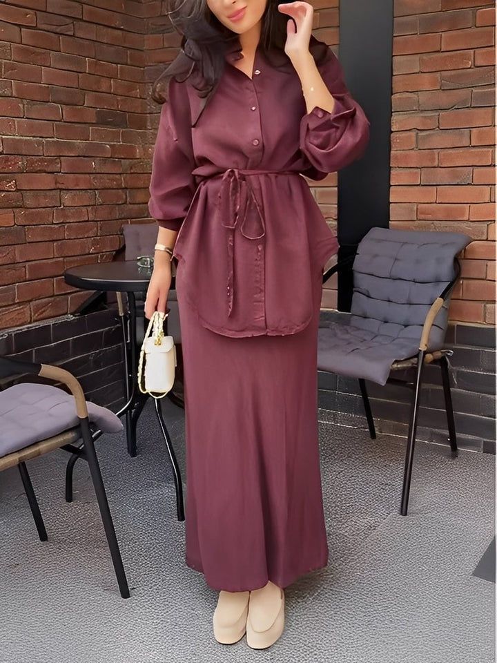 Front view of the long-sleeve tie-drawstring shirt and skirt set showing the adjustable waist tie