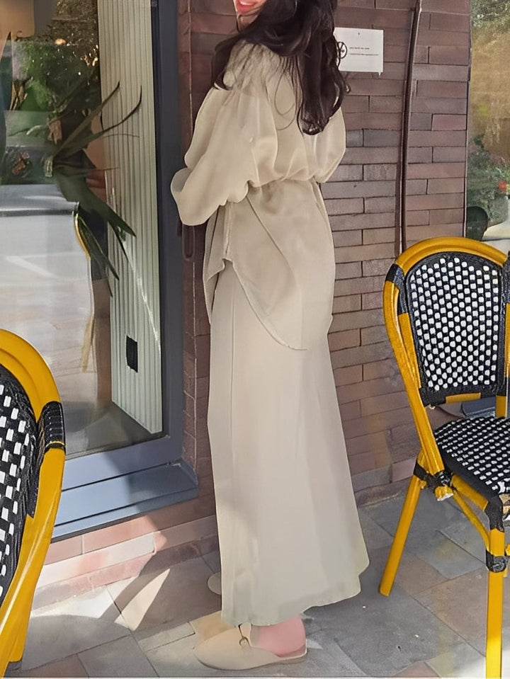 Model showcasing the full coordinated shirt and skirt set in a lifestyle setting