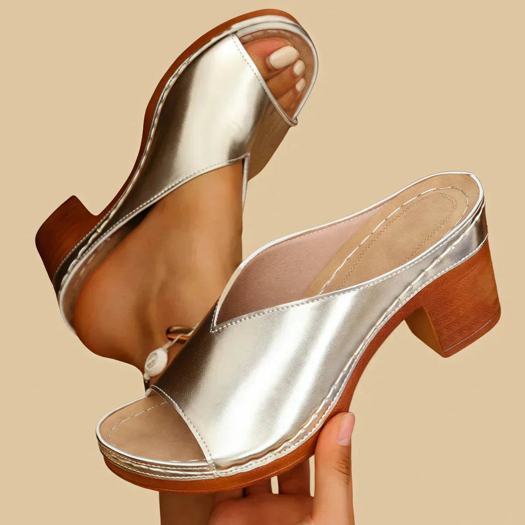 Lisa orthopedic sandal with thick block heel in gold, shown from a front three-quarter angle