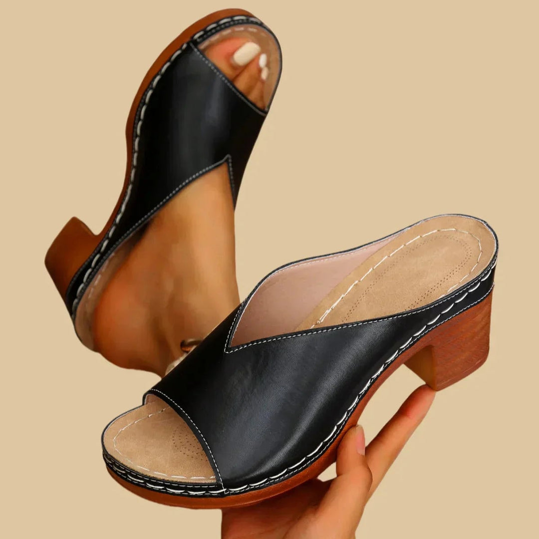 Side profile view of the Lisa open-toe slip-on sandal highlighting the block heel height