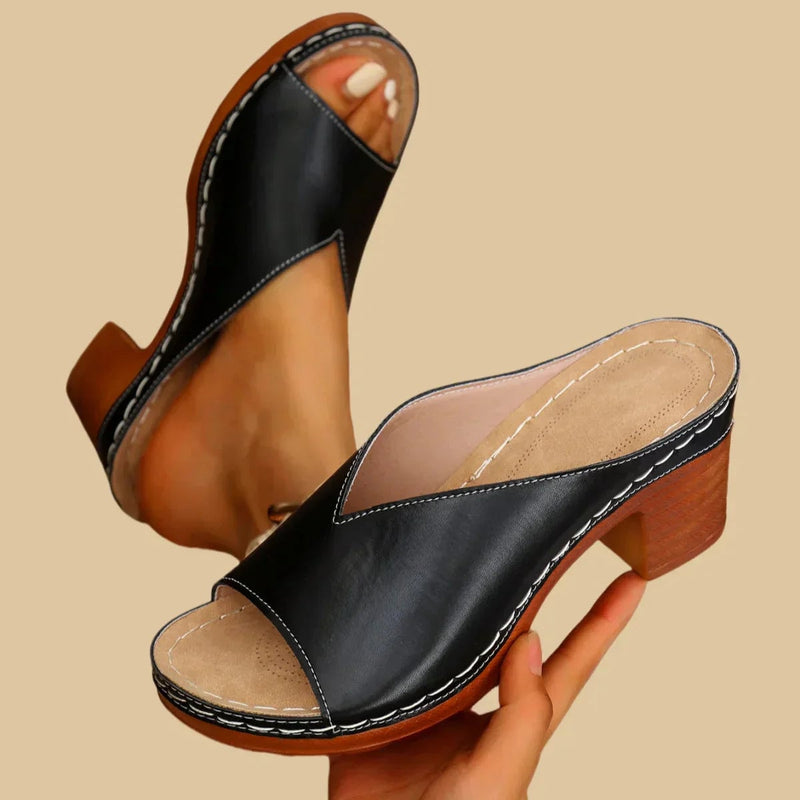 Side profile view of the Lisa open-toe slip-on sandal highlighting the block heel height