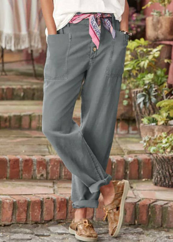 Front view of elegant lightweight trousers in pink showing flattering high-waist pleat detail