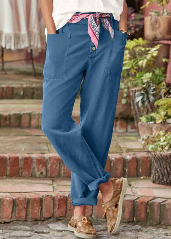 Model styled in Florimay relaxed trousers paired with a casual blouse for a breezy summer look
