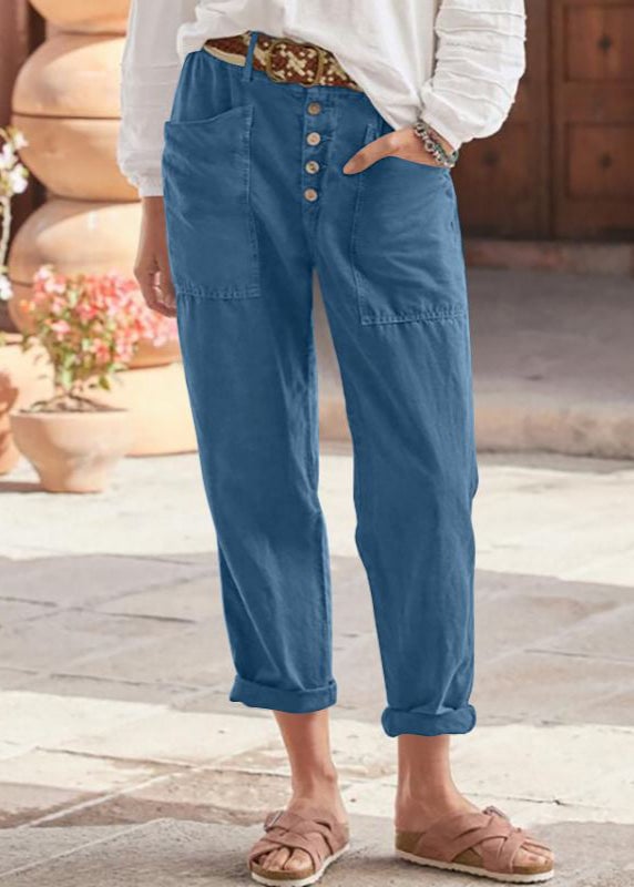 Side view of lightweight high-waist trousers showing fluid drape and silhouette