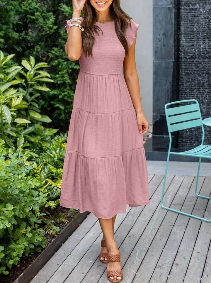 Front view of the Lisette tummy control draped dress in light green